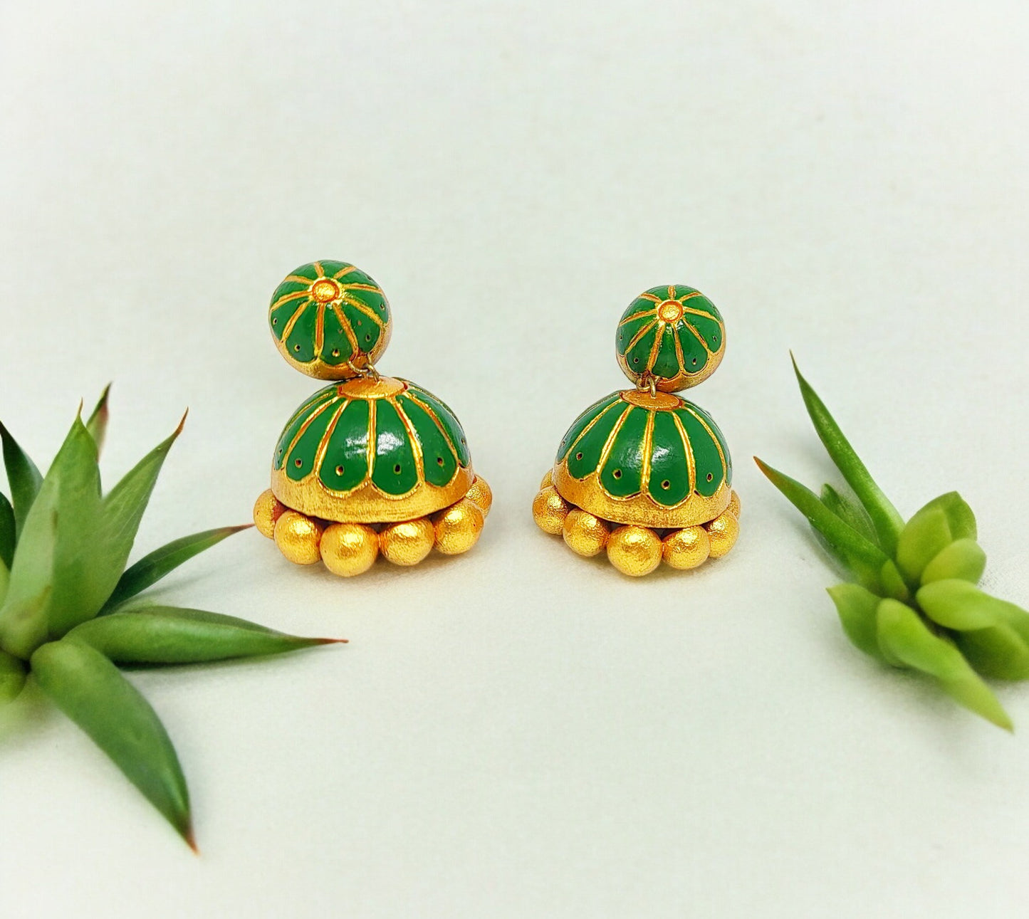 Anusangi Collections unique green terracotta jhumkas with gold bead detailing and dome shape