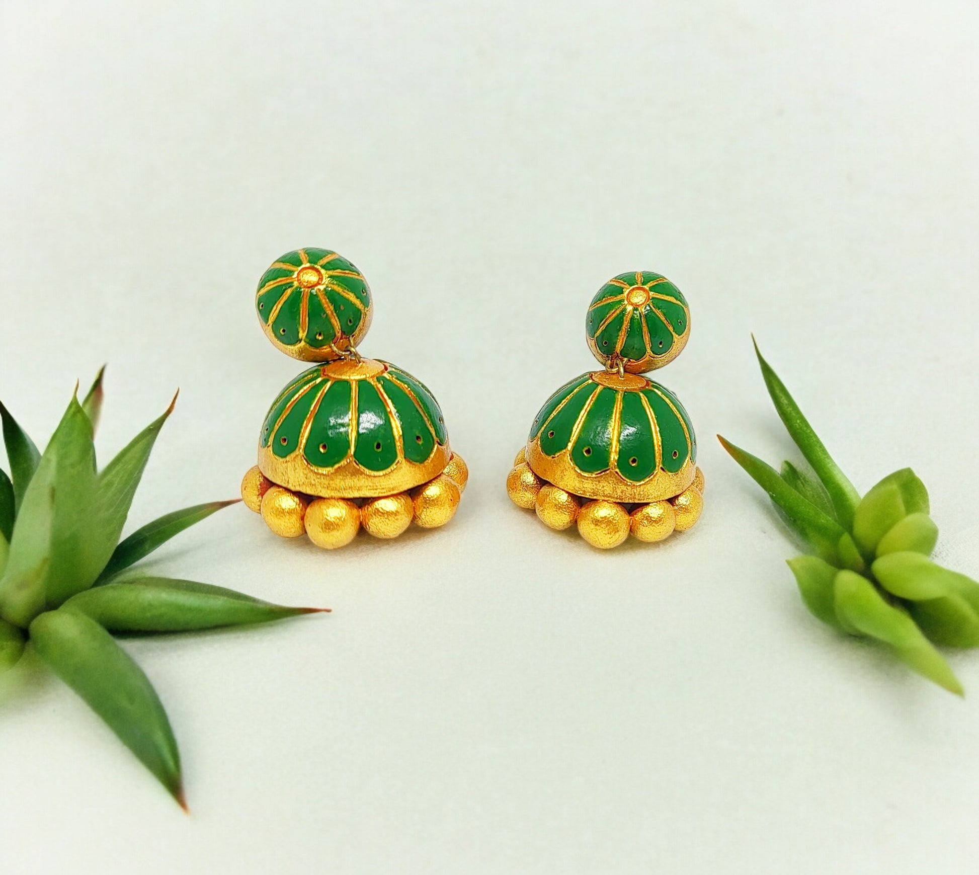 Anusangi Collections unique green terracotta jhumkas with gold bead detailing and dome shape