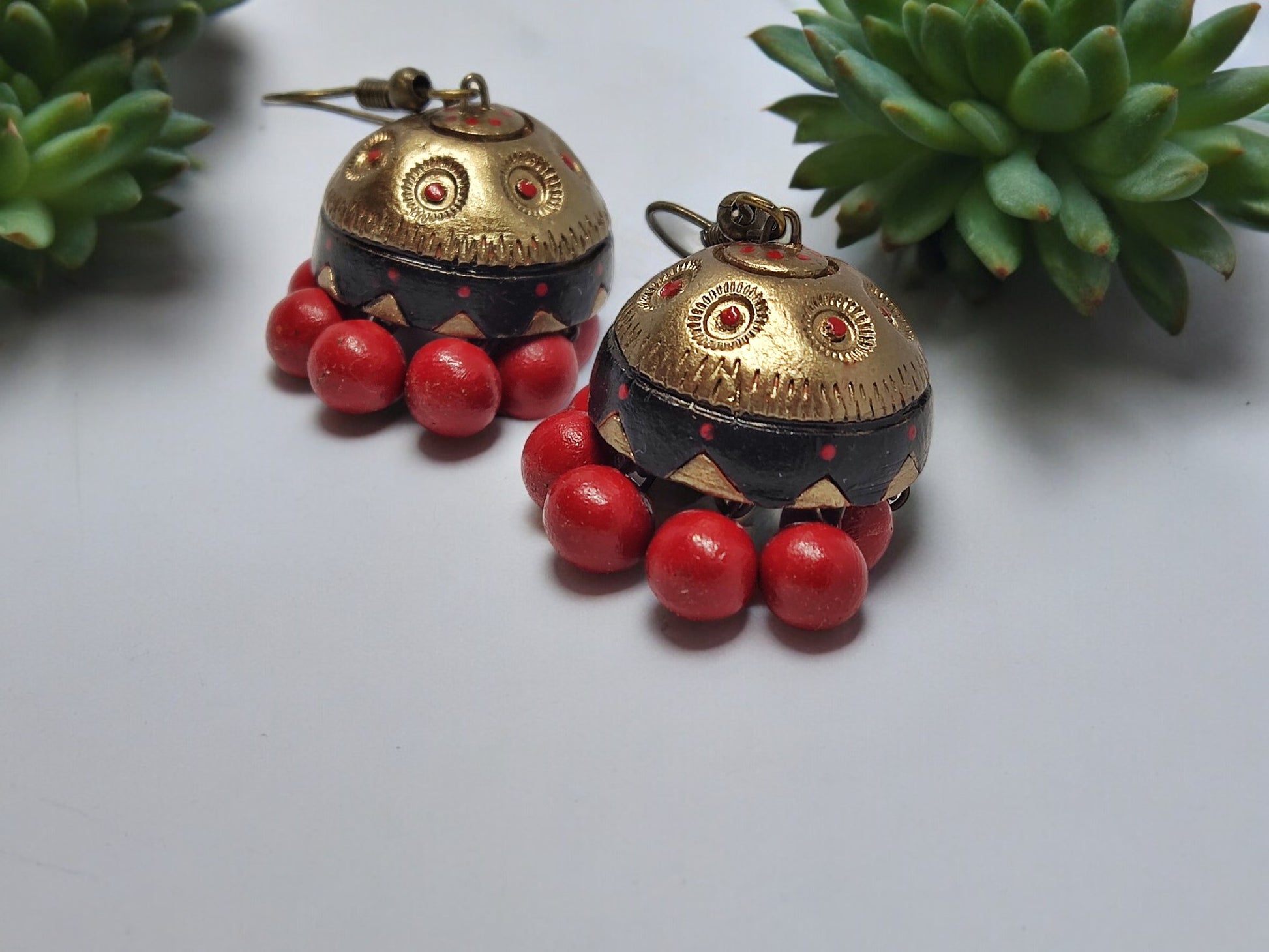 Vaidehi terracotta earrings with red beads and antique gold detailing from Anusangi Collections