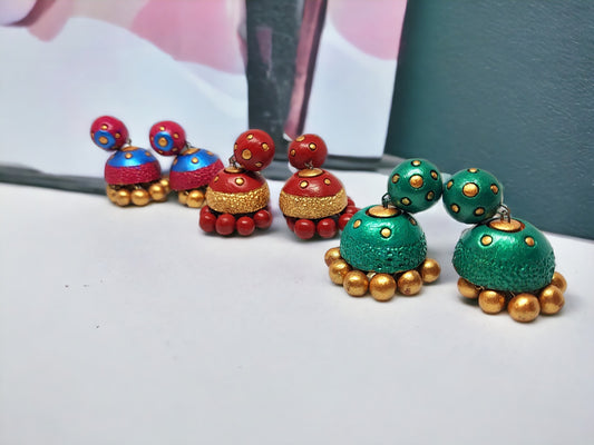 Anusangi Collections Vasundhara terracotta earrings in blue, red, and green with gold bead accents