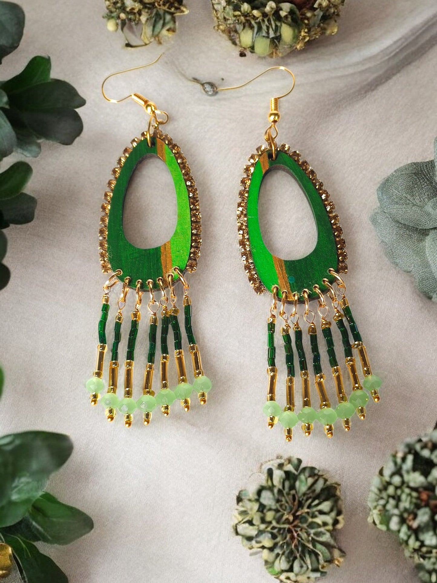 Shades of green dangle earrings with beaded fringe and gold accents from Anusangi Collections