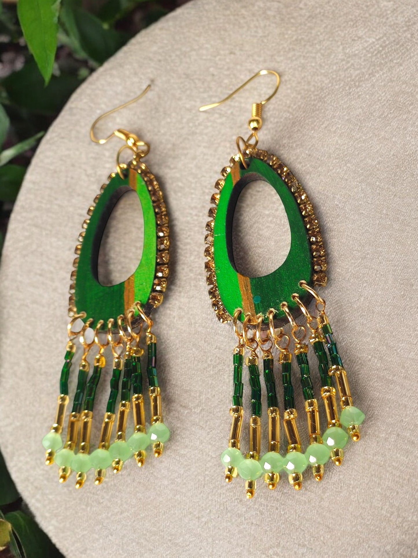 Shades of green dangle earrings from Anusangi Collections featuring beaded design with gold accents