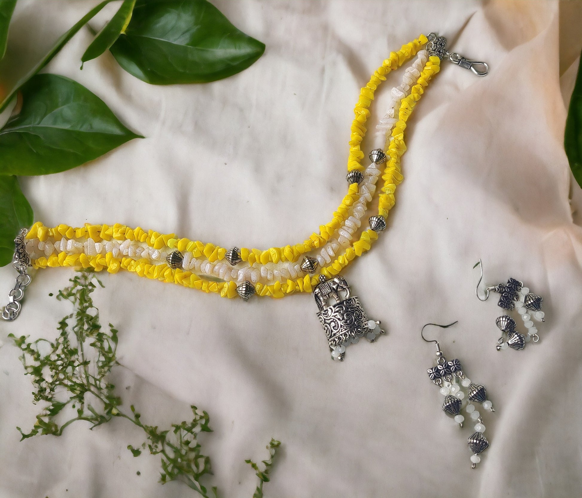 Anusangi Collections uncut beaded choker necklace set with yellow and white beads and matching earrings