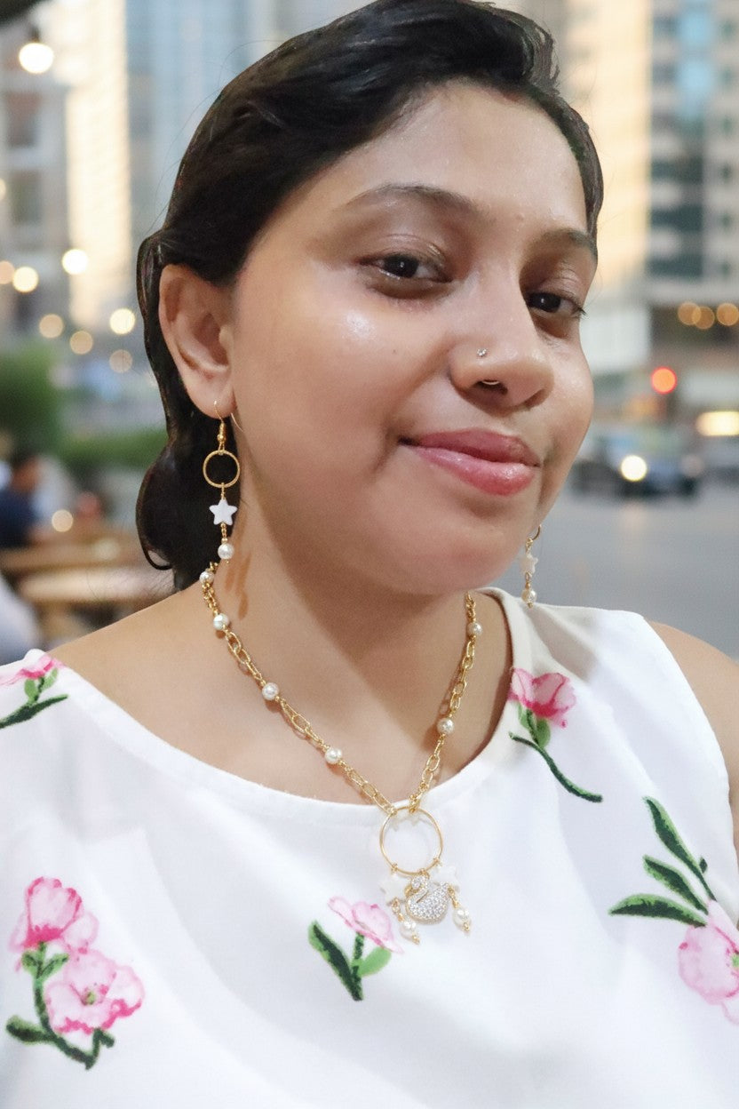 Stunning white pearl station necklace for women paired with matching earrings, perfect for any occasion.