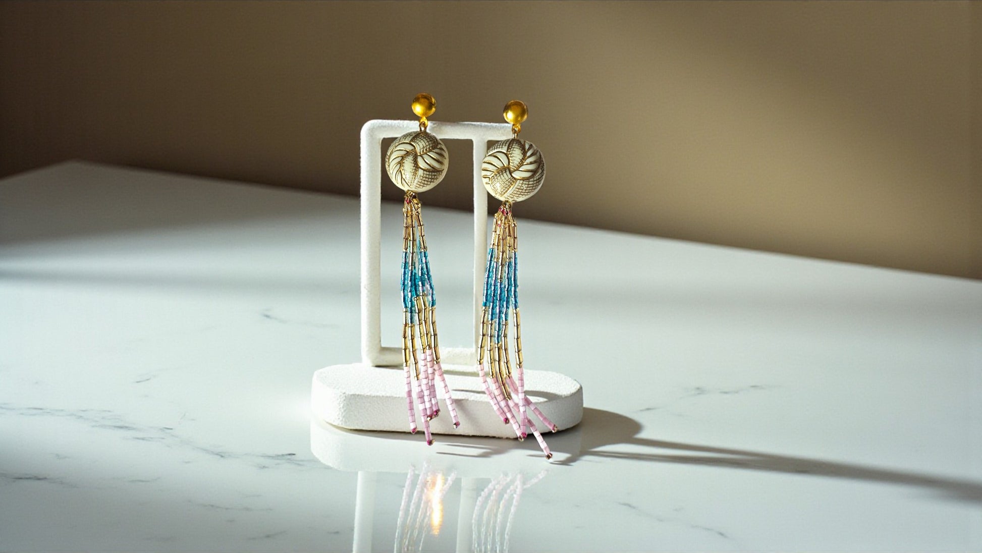 Woven Horizon Tassels Long Multicolor beaded Earrings by Anusangi Collections displayed on white stand